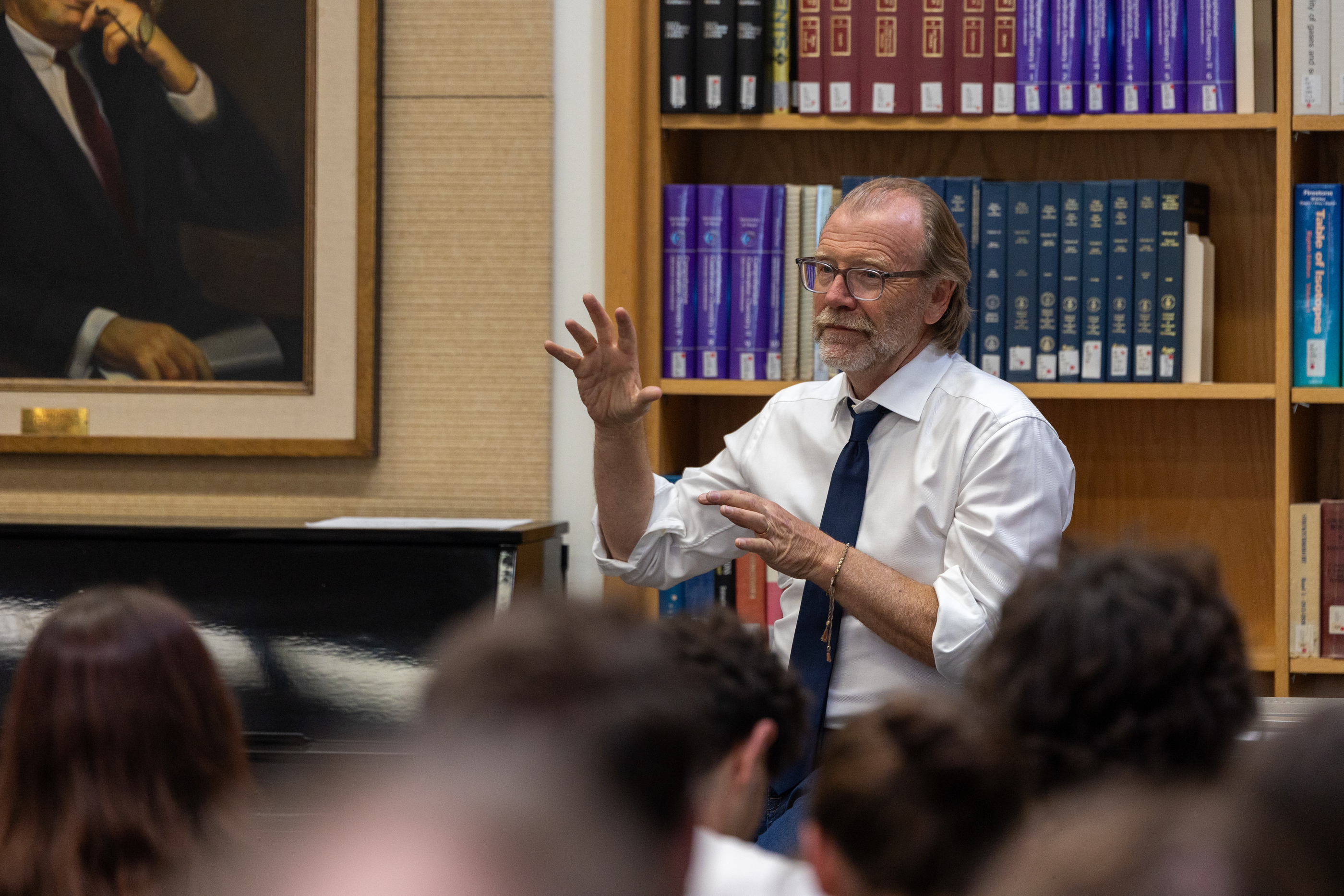 George Saunders talks to group of people in library