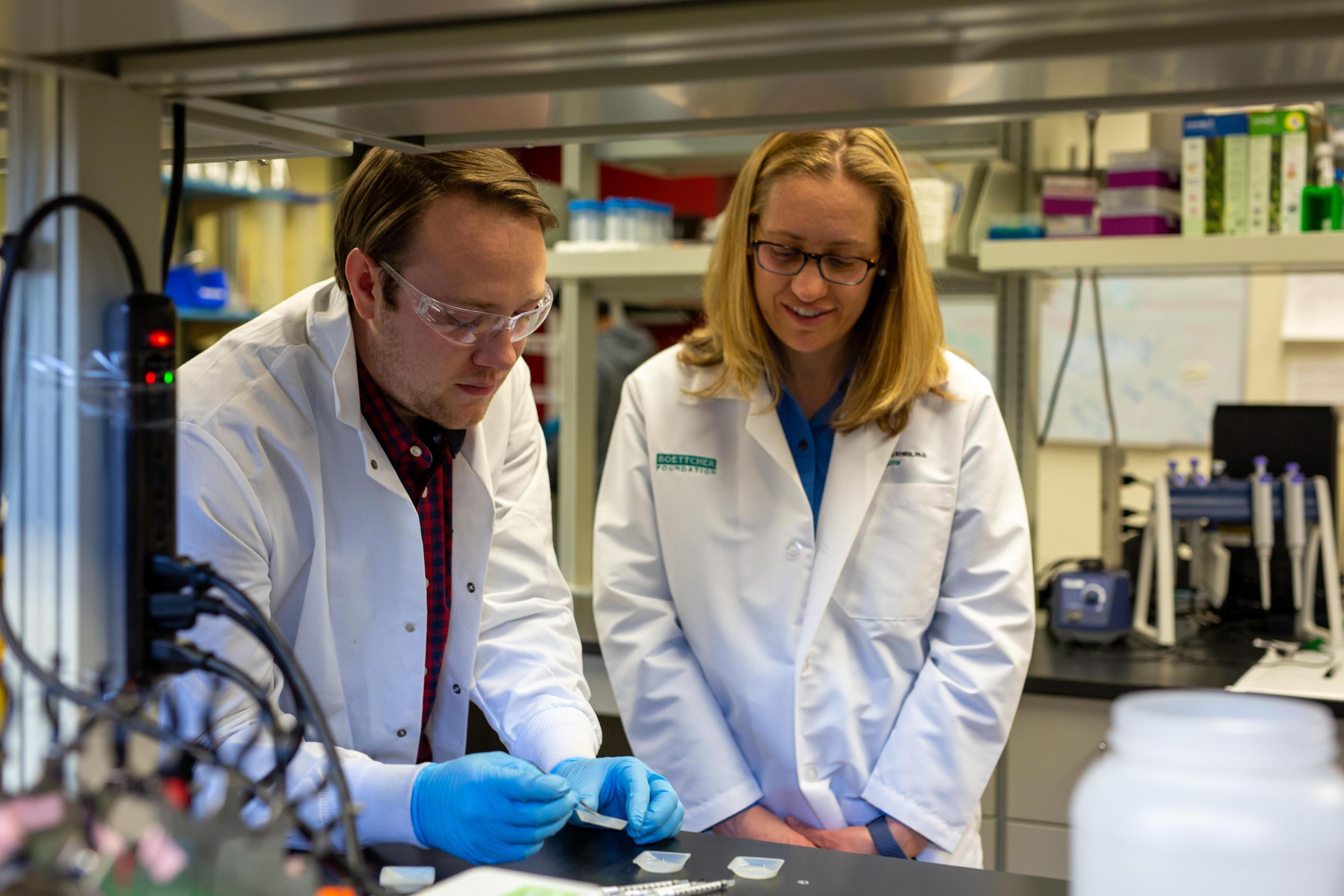 Melissa Krebs works with a student in the lab