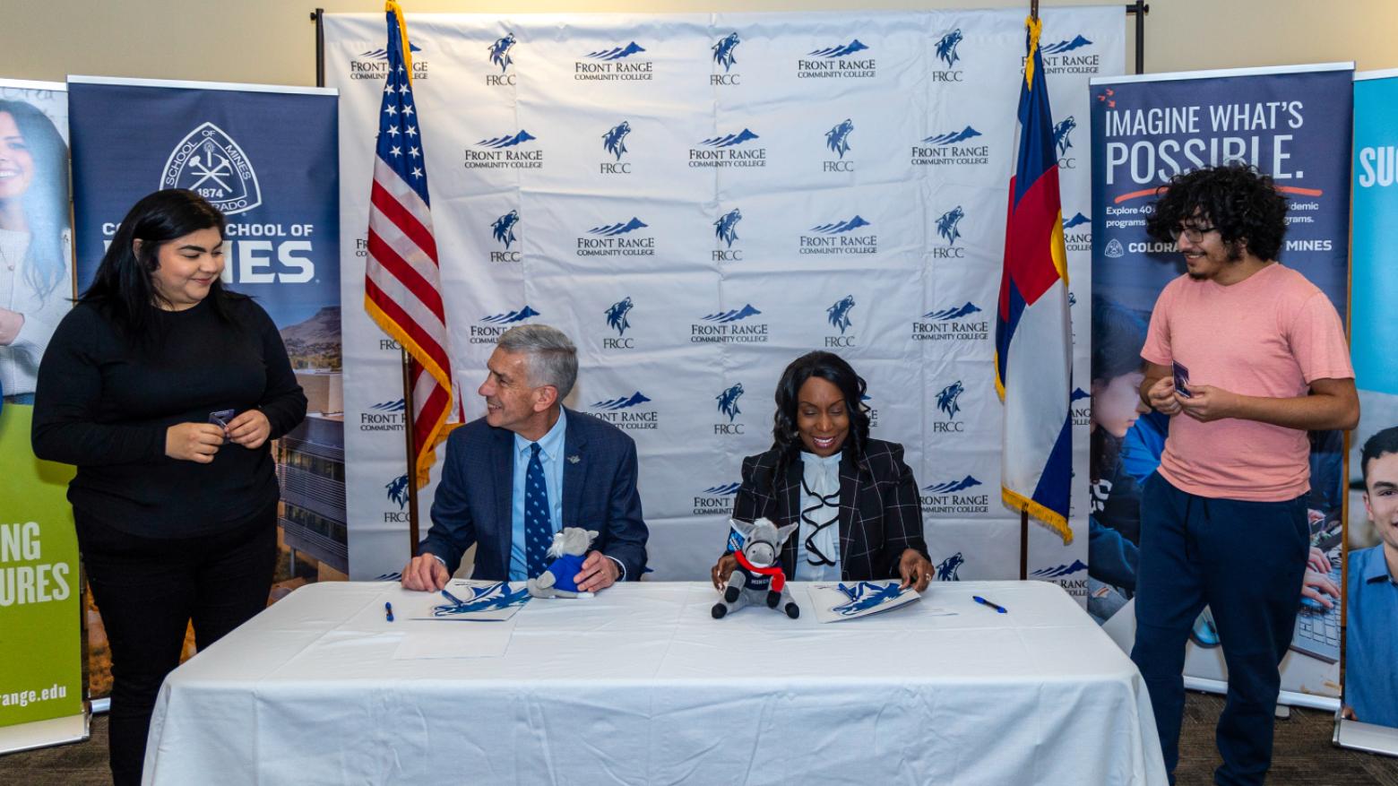 Colorado School of Mines President Paul C. Johnson and Front Range Community College President Colleen Simpson interact with FRCC students after signing the agreement to formally create a new Mines Academy at FRCC on Dec. 7.
