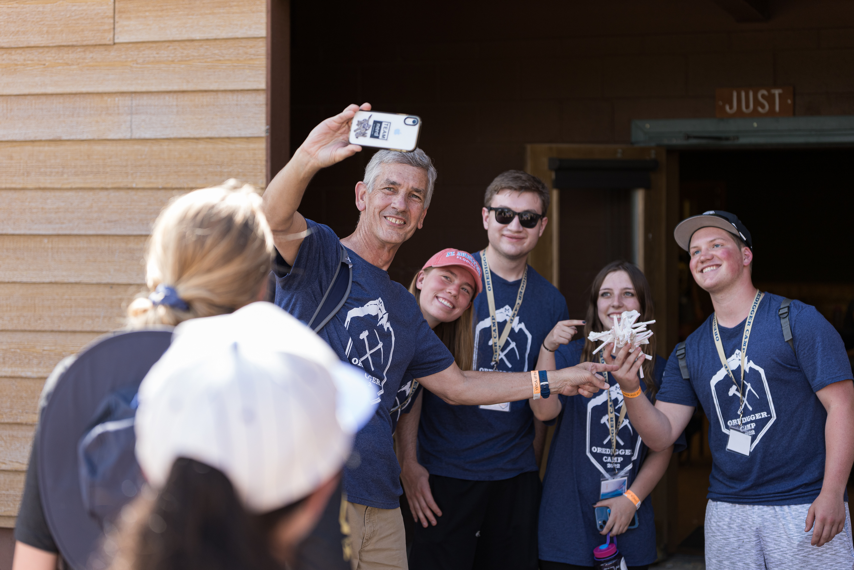 President Johnson takes a selfie with a group of students at Oredigger Camp