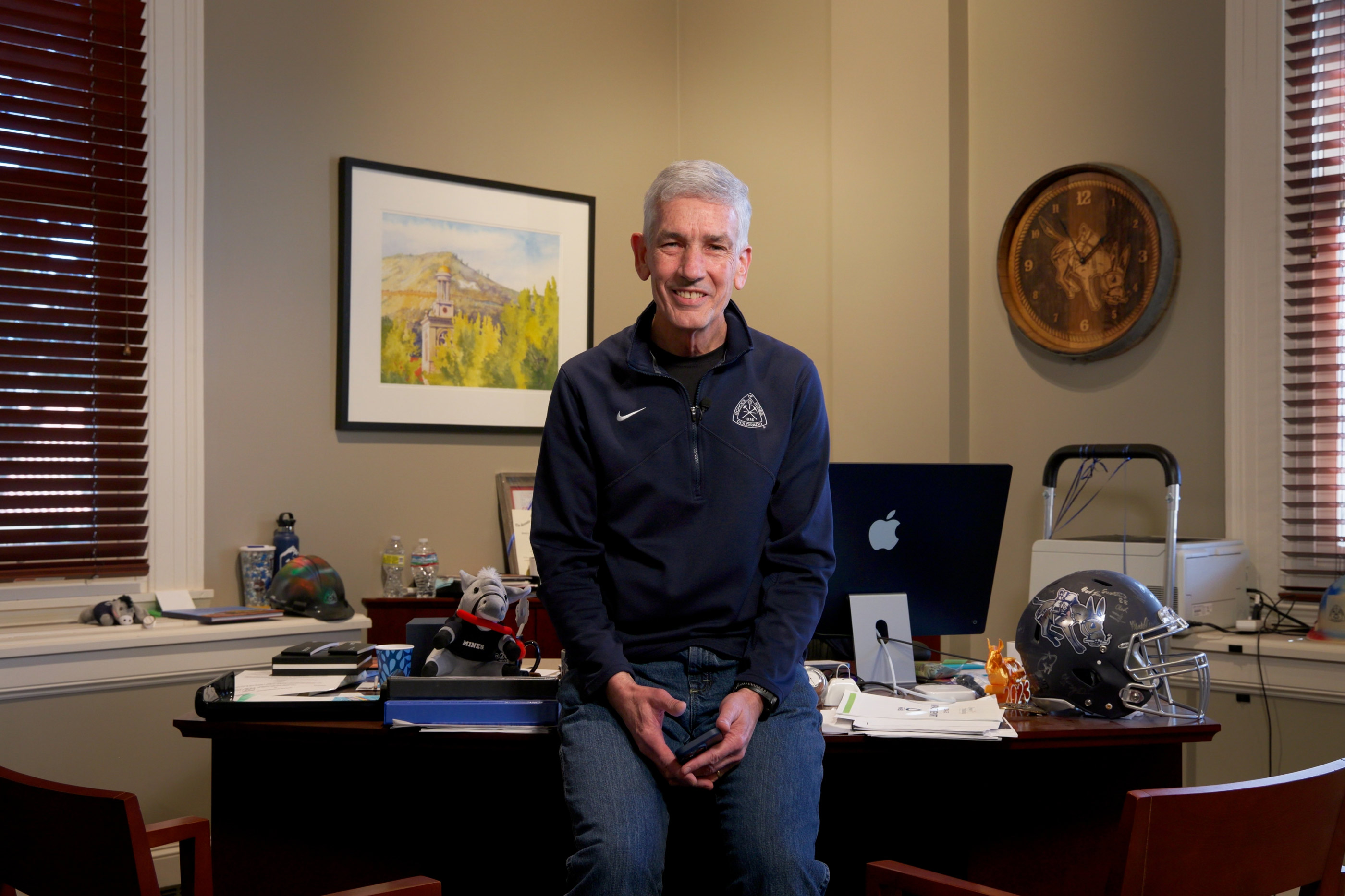 President Paul C. Johnson smiling in his office.