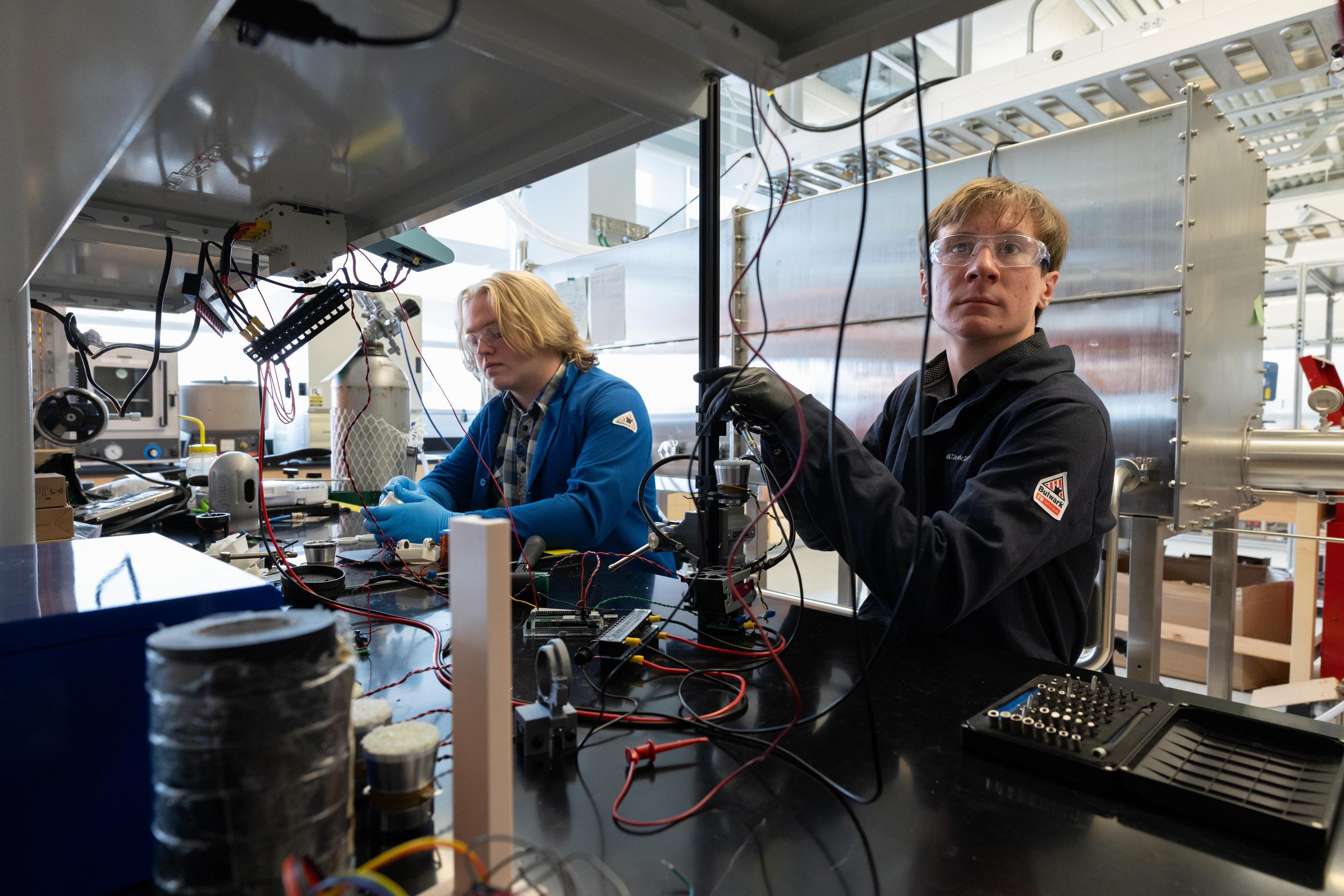 Protofund students John-Austin Little and Austin Arvidson work on their acoustic levitation device FUSE