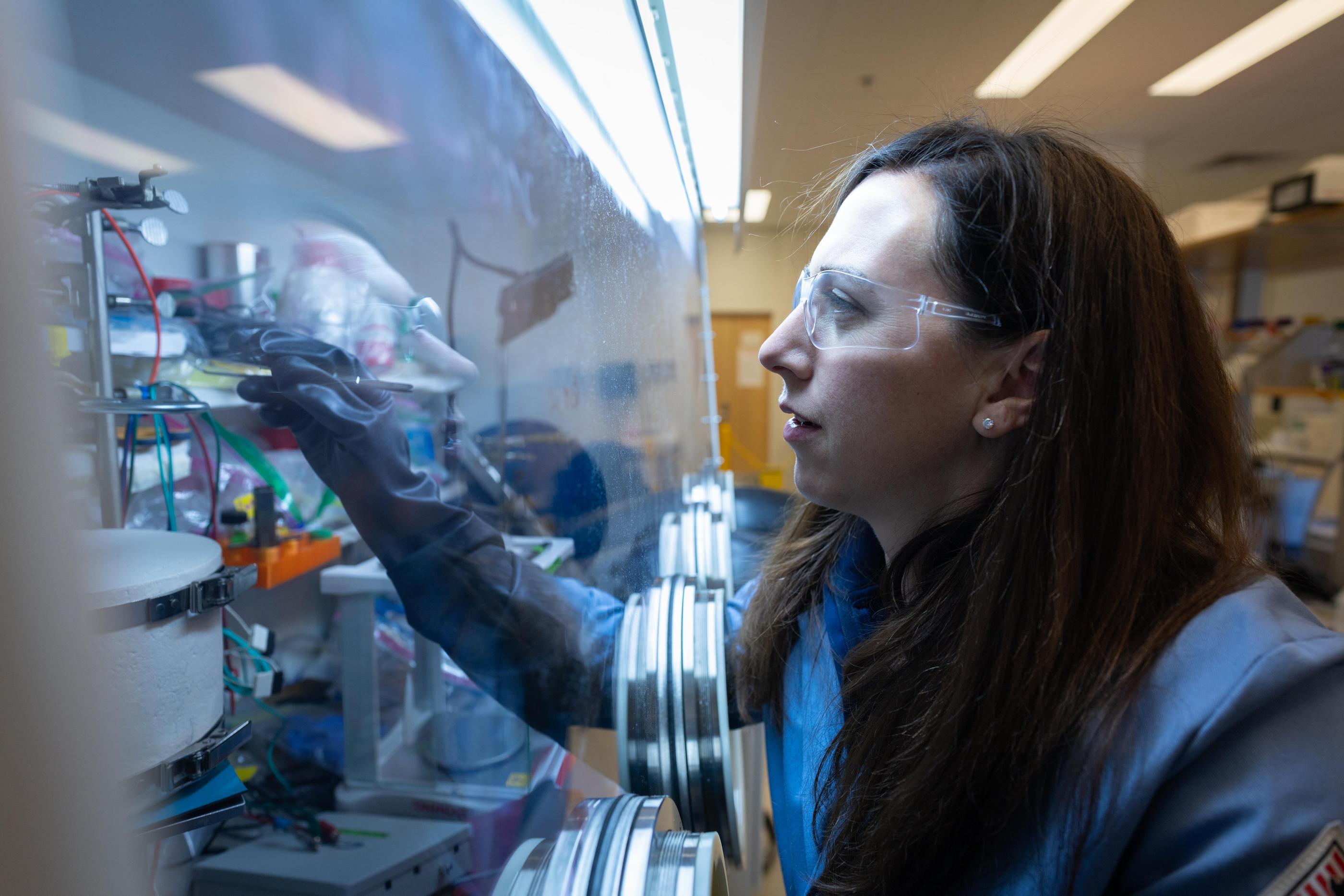 Jen Shafer works in a glove box in the Radiochemistry Lab