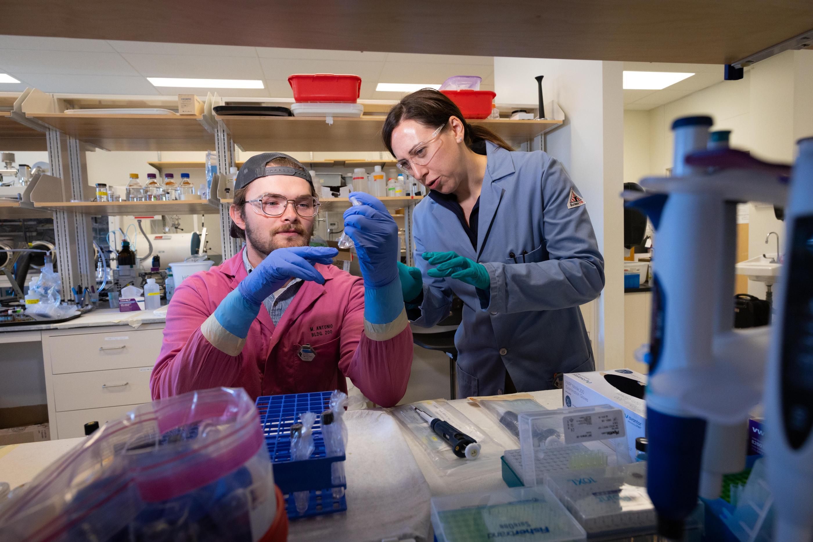 Jen Shafer works with a student in the Radiochemistry Lab