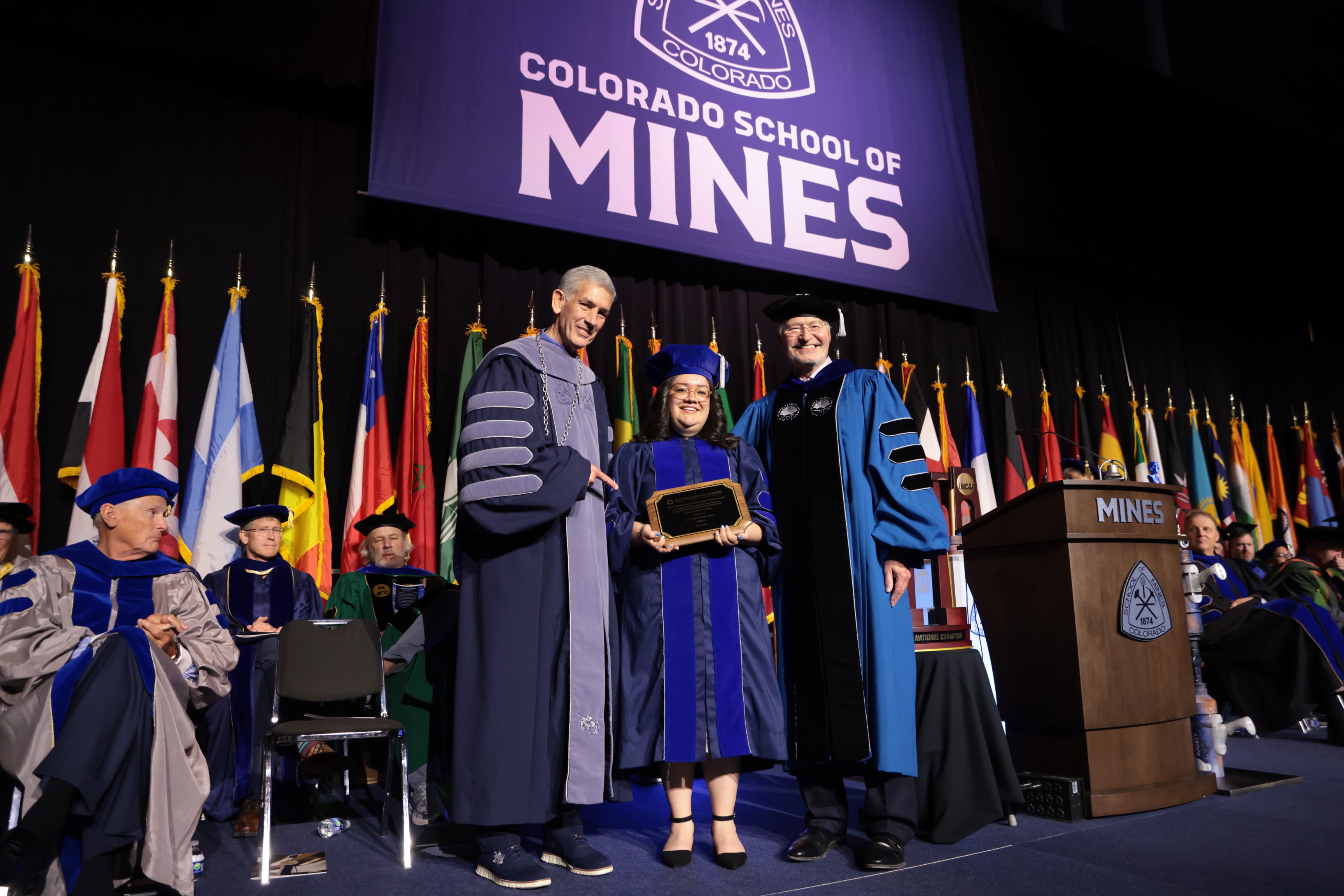 Alexandra Bejarano holds Rath award plaque between President Johnson and Walt Copan