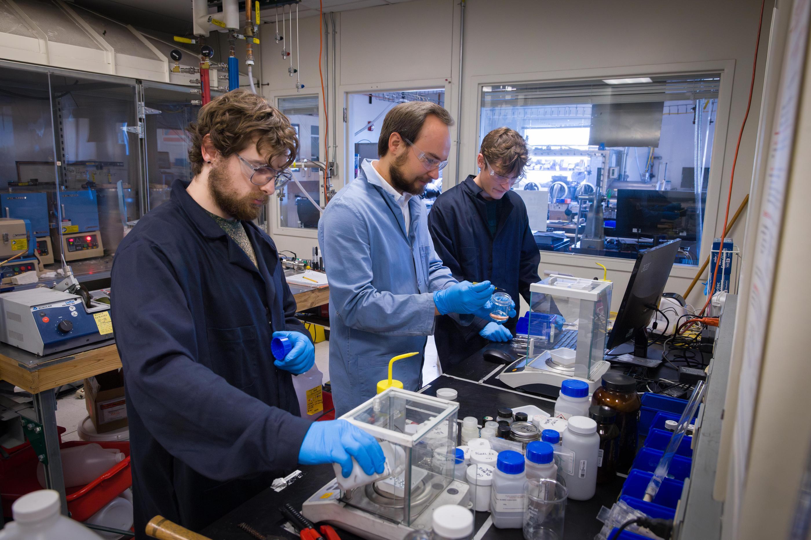 Kamil Ciesielski and students Robert Laurie and Thomas Perkins work on a VIPER program project on quantum materials