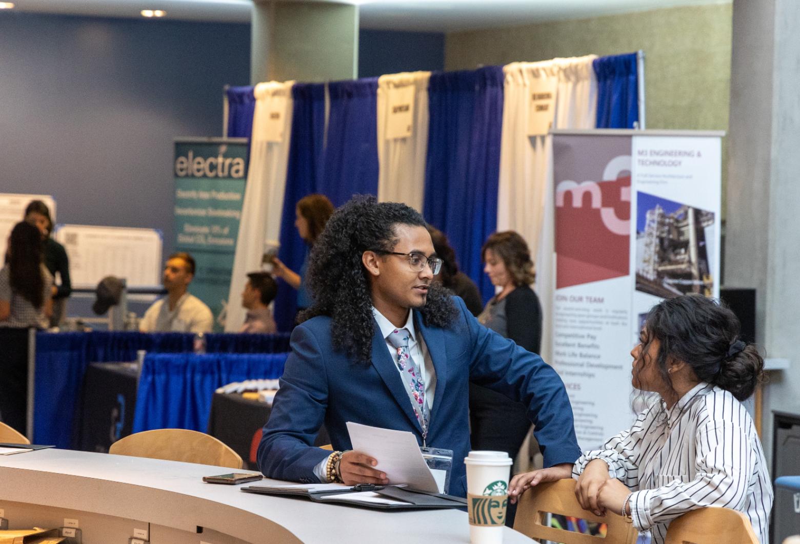 Mines students review their resumes during a break from recruiter interviews at Career Days..