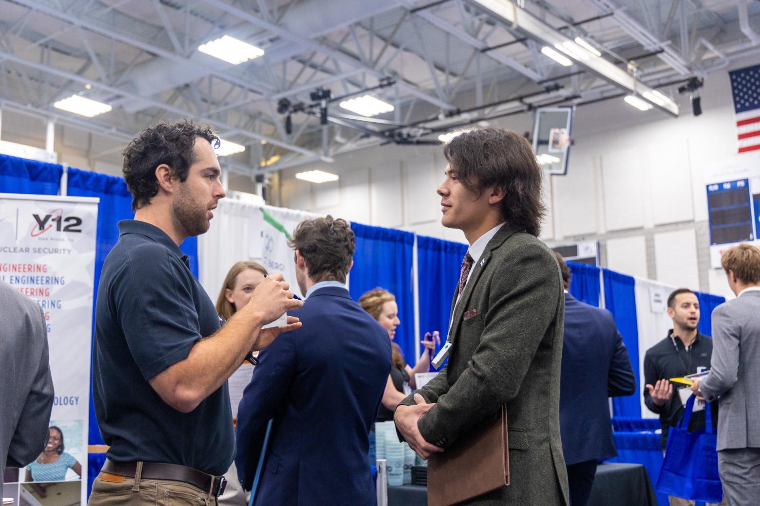 Mines student Geoffrey Pott speaks with a recruiter from Consolidated Nuclear Security.