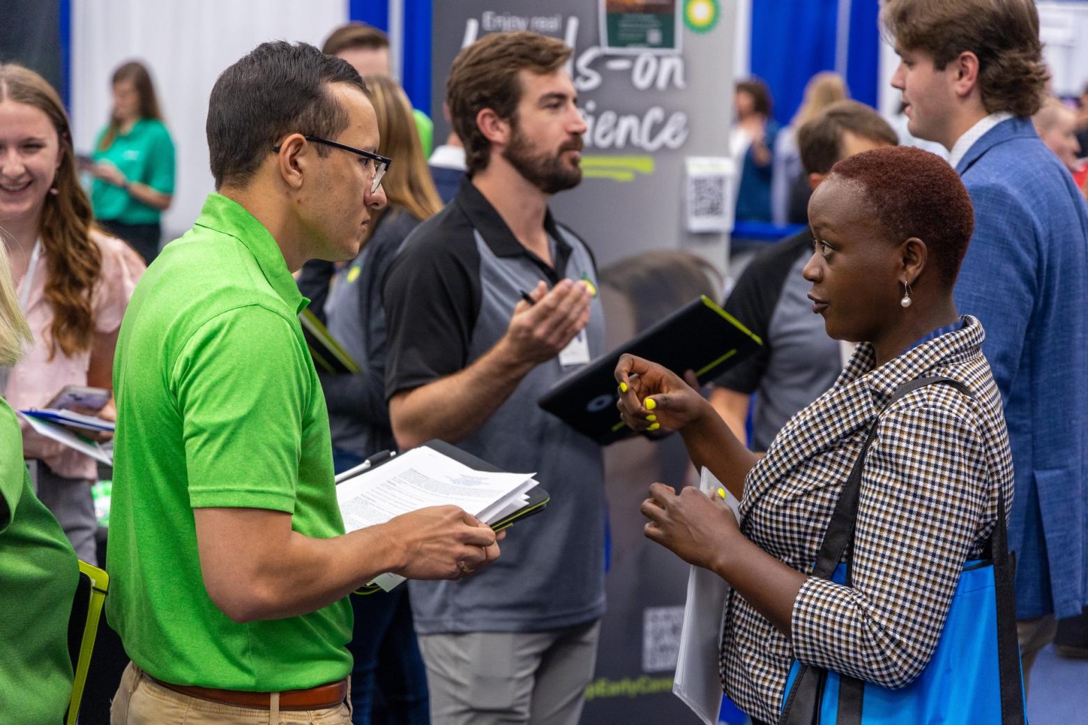A Mines student speaks with a recruiter at Mines Career Day.