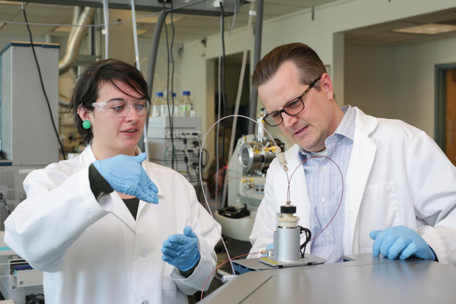 Chris Higgins working with a student researcher in PFAS research
