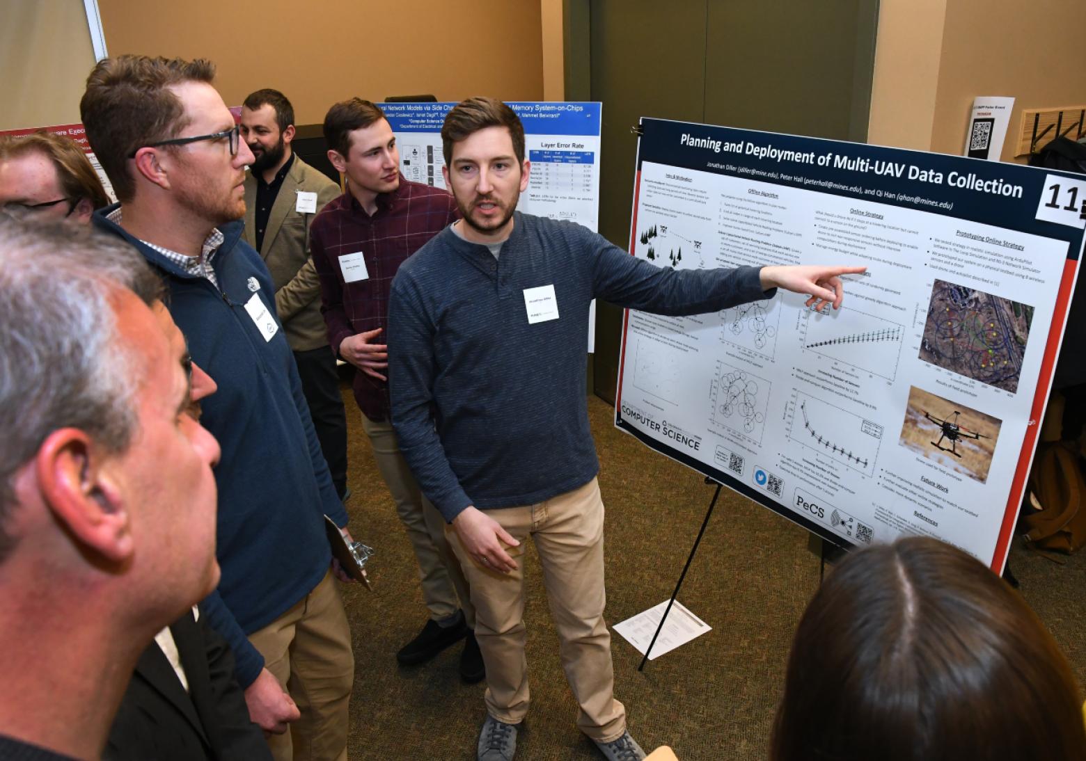 PhD student Jonathan Diller sharing his poster