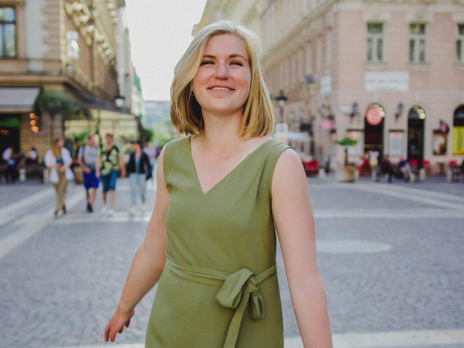 Profile photo of Mines alum Peyton Gibson smiling in a town square.