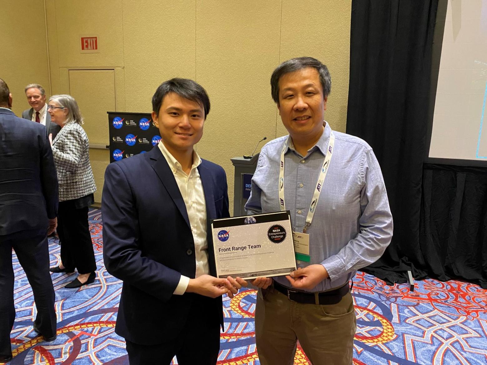 A Mines student poses with an award