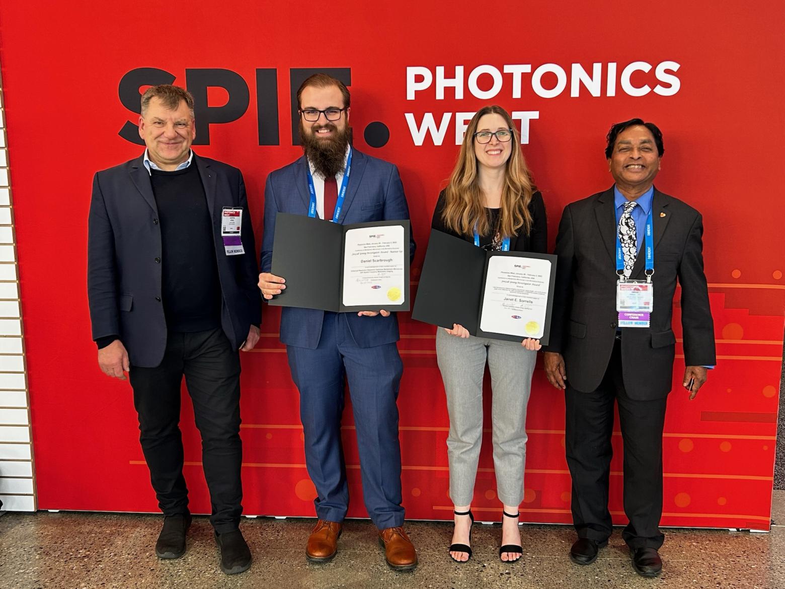 Daniel Scarbrough posing for a photo with other after receiving the Jen Lab Award