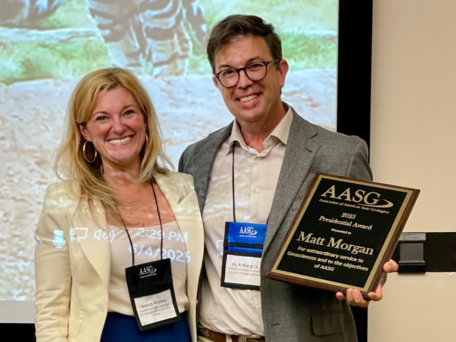 Matt Morgan poses with award with AASG President