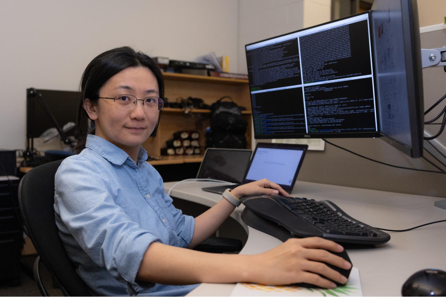 Sihui Li working on a computer