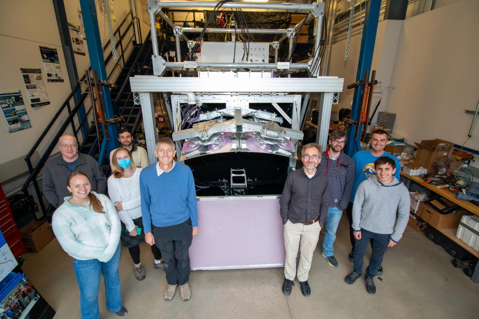 Researchers standing in front of the NASA space balloon