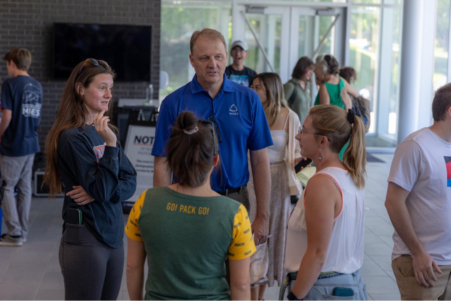 Mines Provost Rick Holz visits with student researchers during the Fall 2023 Undergraduate Research Symposium.