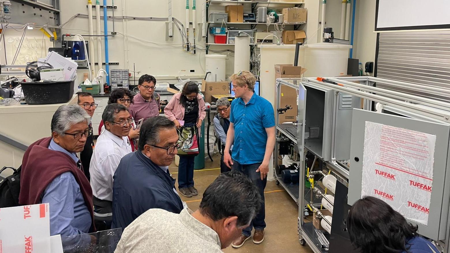 A group of UNSA professors tour a lab at Mines