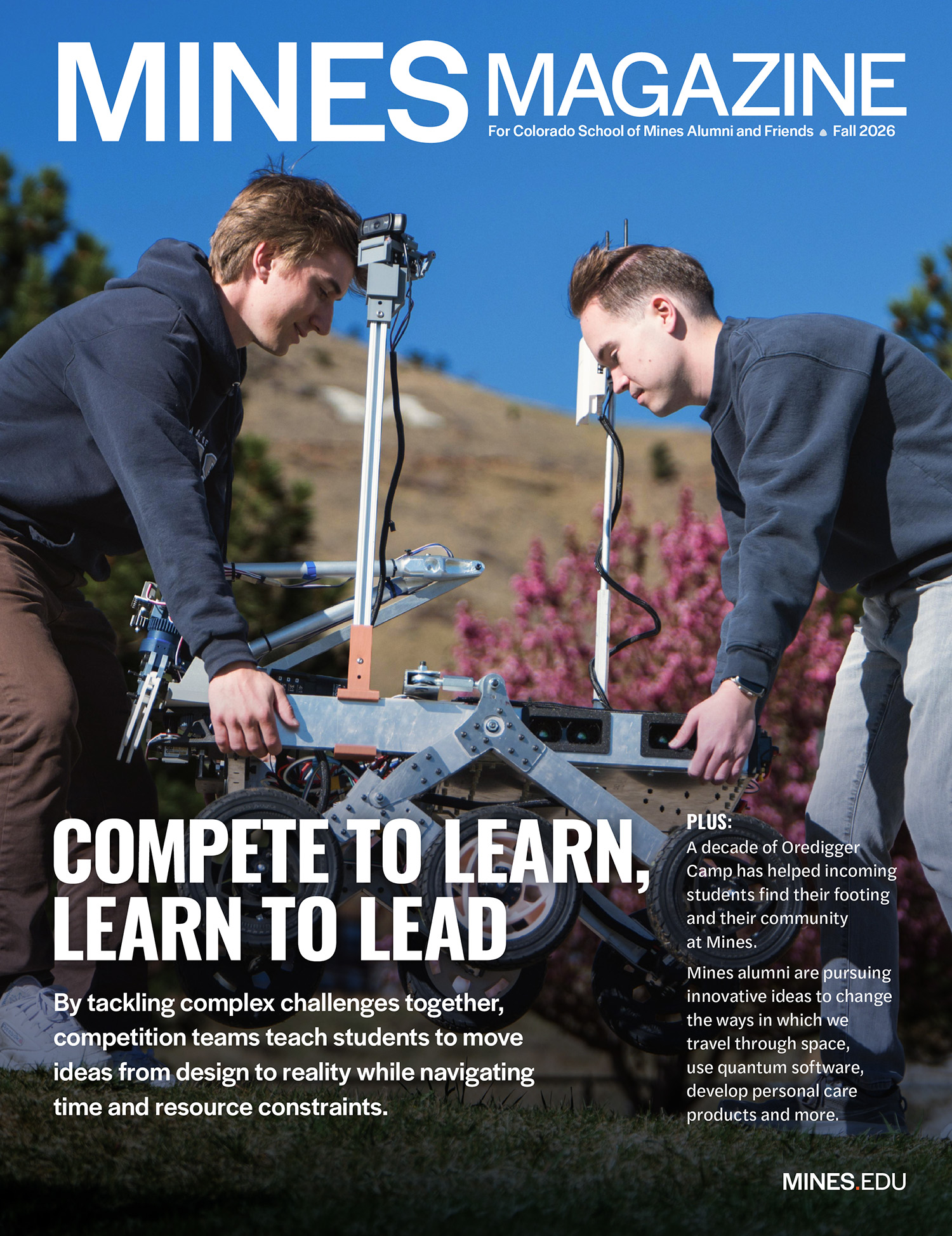 Mines Magazine Fall 2026 cover image showing two male students carrying a rover