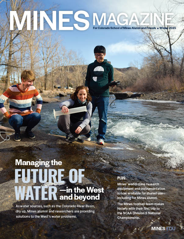Cover of Mines Magazine Winter 2023 issue with three researchers study water flow in a rocky river, using scientific equipment, with leafless trees and hills in the background.