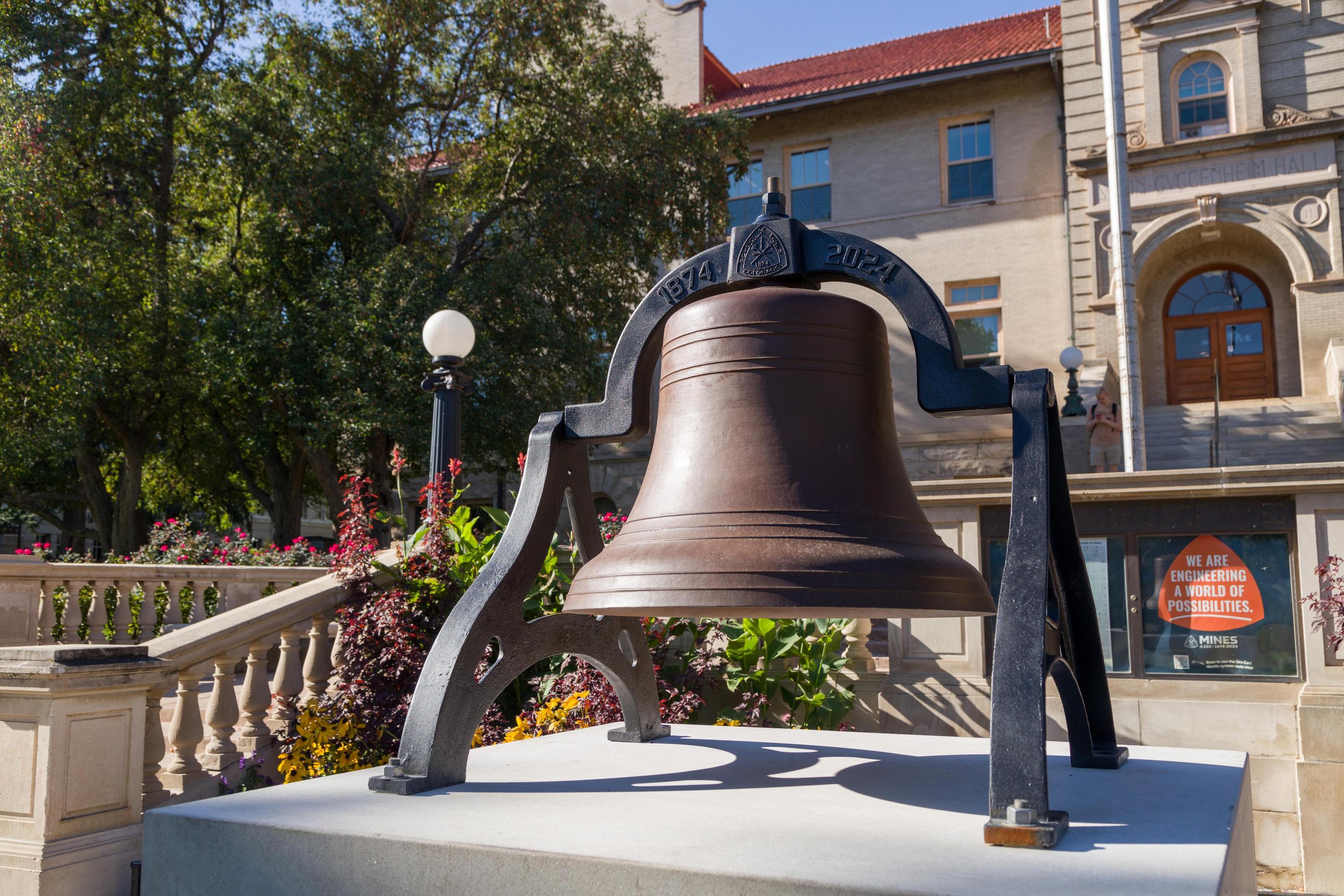 Commemorative sesquicentennial bell in front of Guggenheim Hall