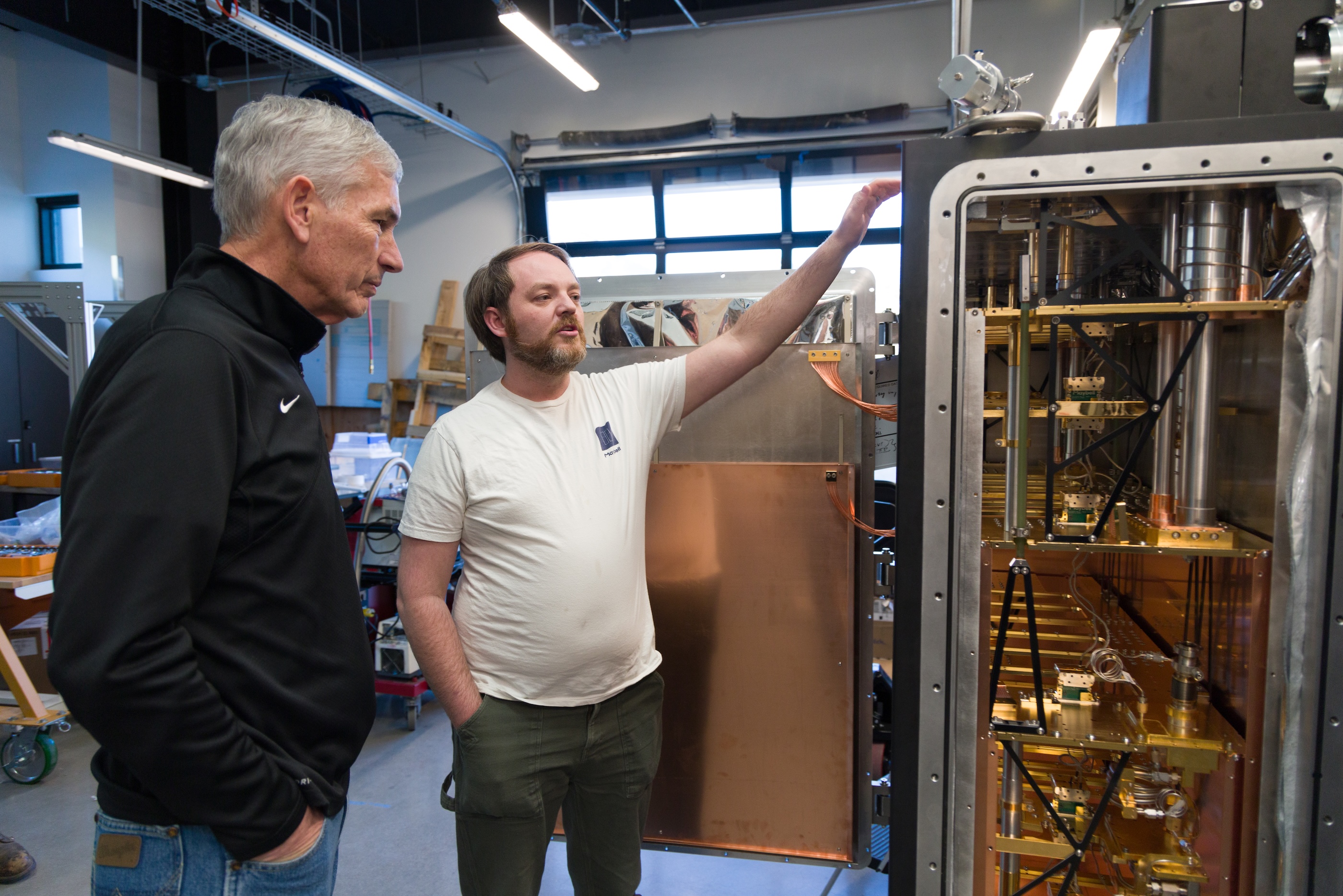 Paul C. Johnson and Corban Tillemann-Dick inspect the Maybell Big Fridge on campus.