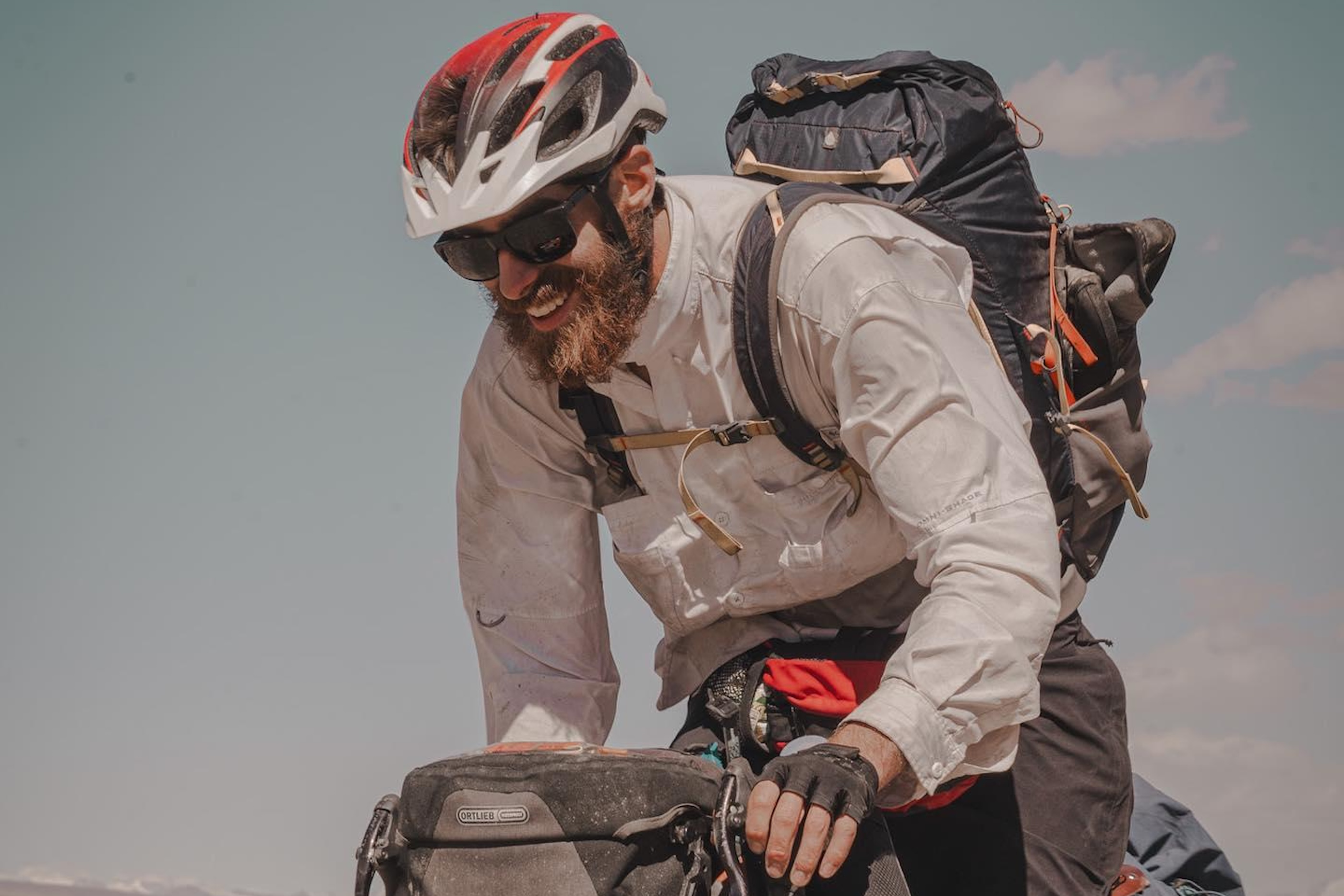 Peter Consalvi wearing a bicycle helmet and sunglasses