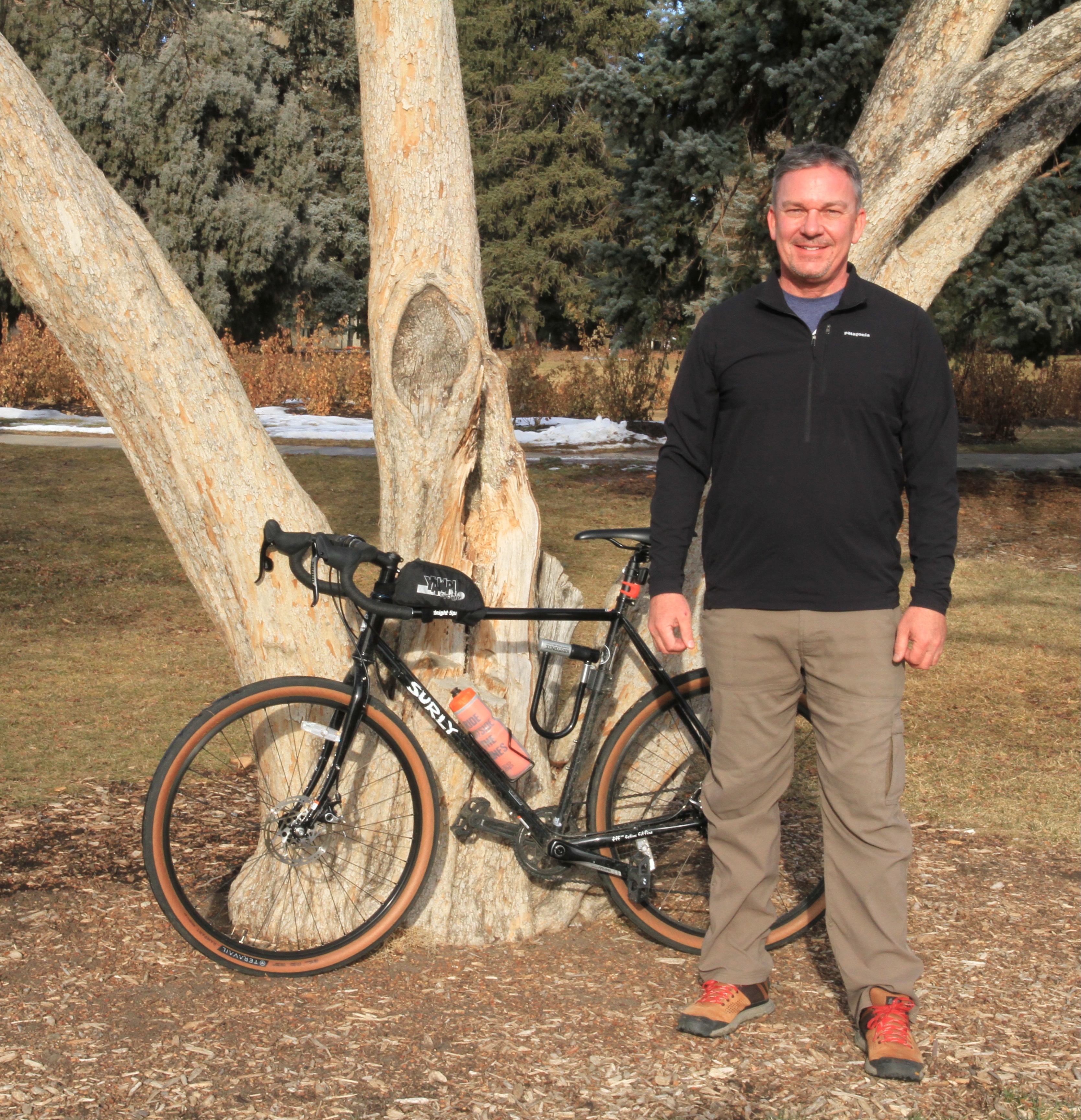 Jeff Gillow standing next to a bicycle