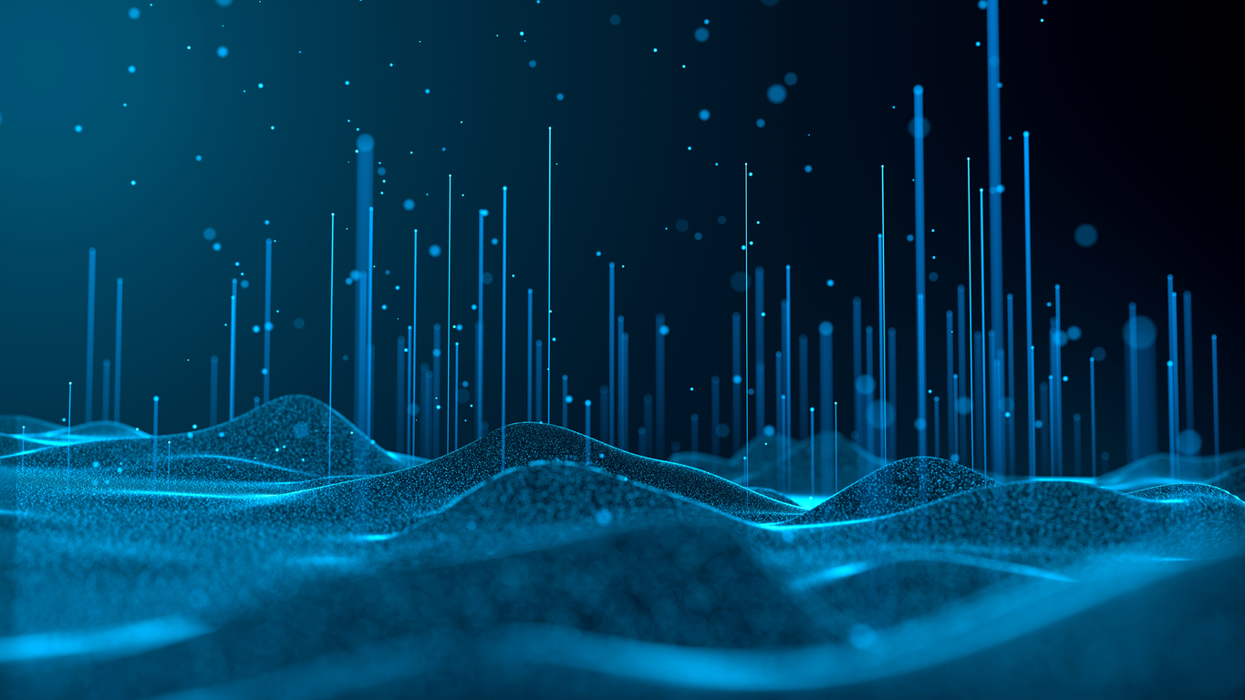 Abstract digital landscape of glowing blue waves made of particles, with vertical lines and floating points of light against a dark background, evoking data, technology and quantum computing.